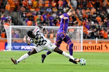 Mar 15, 2025; Houston, Texas, USA; Real Salt Lake forward Forster Ajago (27) steals the ball from Houston Dynamo midfielder Griffin Dorsey (25) during the second half at Shell Energy Stadium. Mandatory Credit: Maria Lysaker-Imagn Images