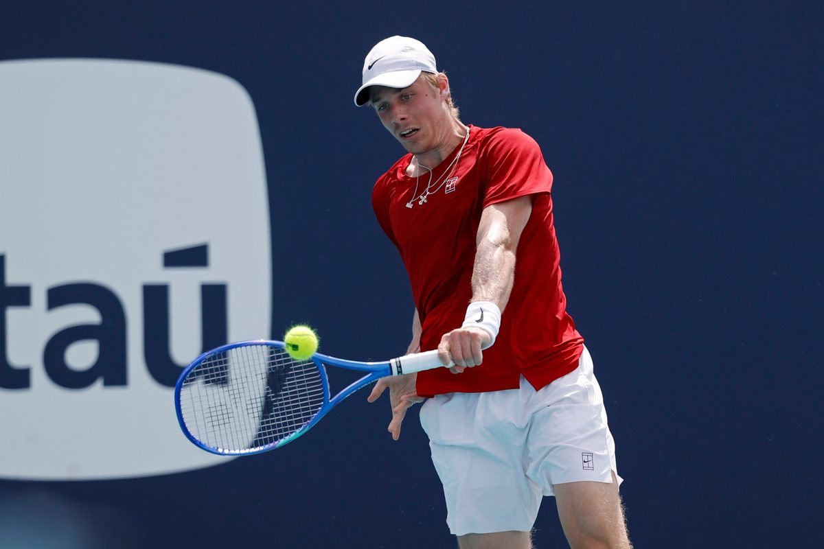 Mar 24, 2025; Miami, FL, USA; Denis Shapovalov (CAN) hits a backhand against Taylor Fritz (USA)(not pictured) on day seven of the Miami Open at Hard Rock Stadium. Mandatory Credit: Geoff Burke-Imagn Images