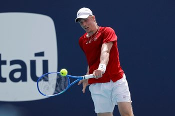 Mar 24, 2025; Miami, FL, USA; Denis Shapovalov (CAN) hits a backhand against Taylor Fritz (USA)(not pictured) on day seven of the Miami Open at Hard Rock Stadium. Mandatory Credit: Geoff Burke-Imagn Images