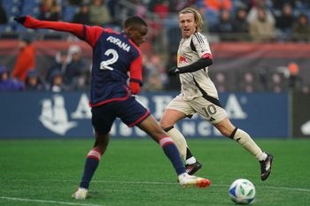 Mar 29, 2025; Foxborough, Massachusetts, USA; New York Red Bulls midfielder Emil Forsberg (10) passes the ball against New England Revolution defender Mamadou Fofana (2) in the second half at Gillette Stadium. Mandatory Credit: David Butler II-Imagn Images
