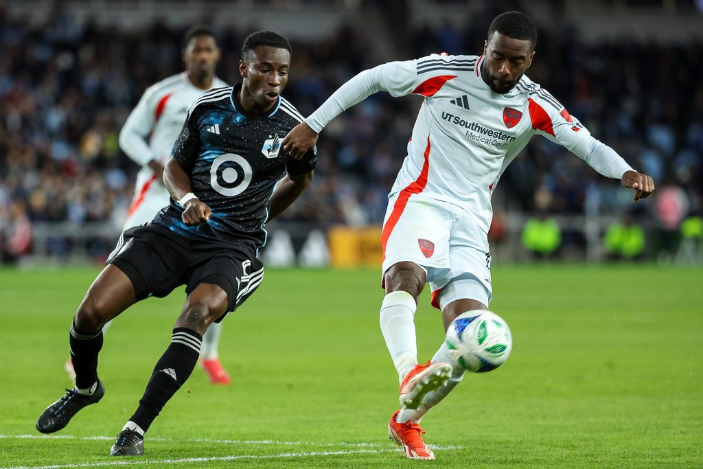 Apr 19, 2025; Saint Paul, Minnesota, USA; FC Dallas defender Shaq Moore (18) and Minnesota United forward Kelvin Yeboah (9) compete for the ball during the second half at Allianz Field. Mandatory Credit: Matt Krohn-Imagn Images