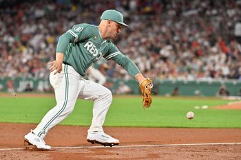 May 16, 2025; Boston, Massachusetts, USA; Boston Red Sox third baseman Alex Bregman (2) makes an error at third during the seventh inning against the Atlanta Braves at Fenway Park. Mandatory Credit: Eric Canha-Imagn Images
