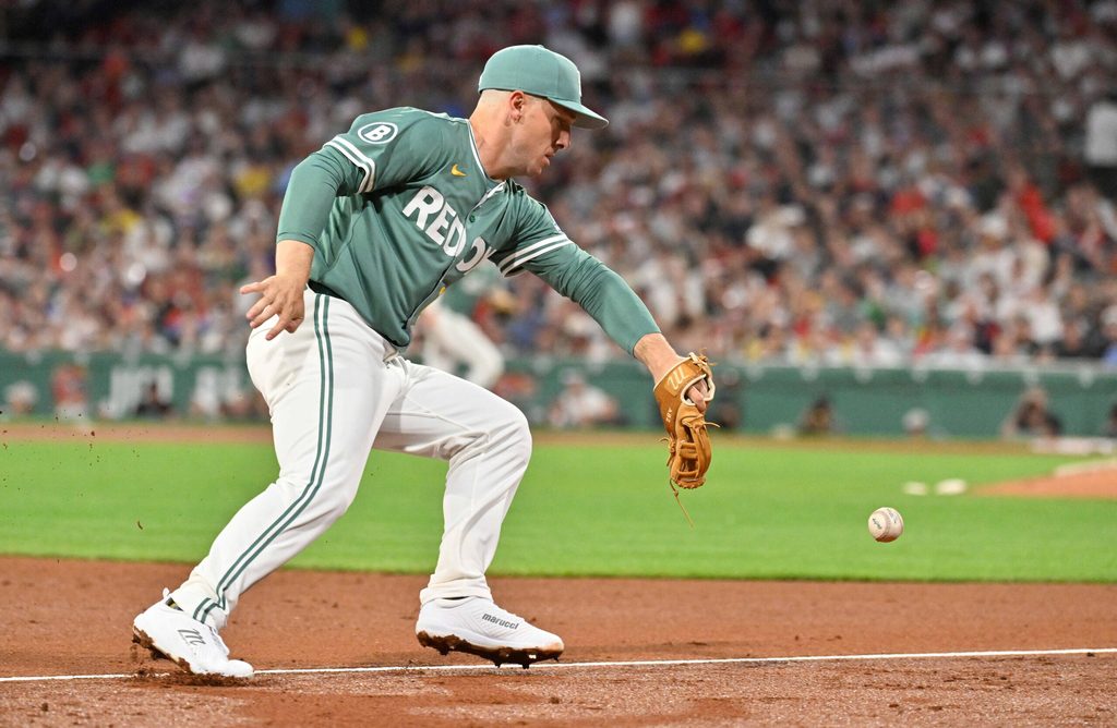 May 16, 2025; Boston, Massachusetts, USA; Boston Red Sox third baseman Alex Bregman (2) makes an error at third during the seventh inning against the Atlanta Braves at Fenway Park. Mandatory Credit: Eric Canha-Imagn Images