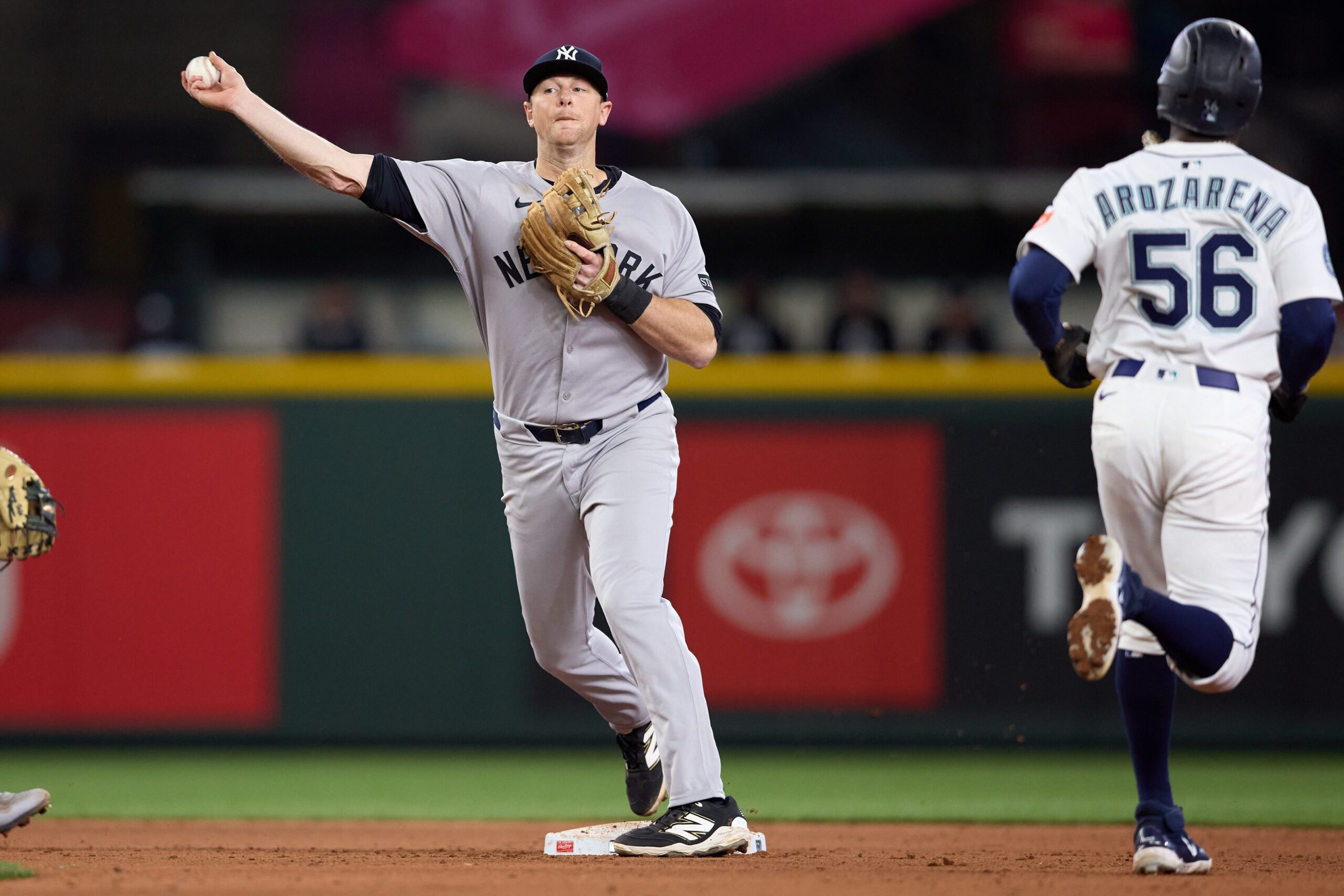May 14, 2025; Seattle, Washington, USA; New York Yankees second baseman DJ Lemahieu (26) forces out Seattle Mariners left fielder Randy Arozarena (56) and completes a double play against the Seattle Mariners during the eighth innning at T-Mobile Park. Mandatory Credit: John Froschauer-Imagn Images