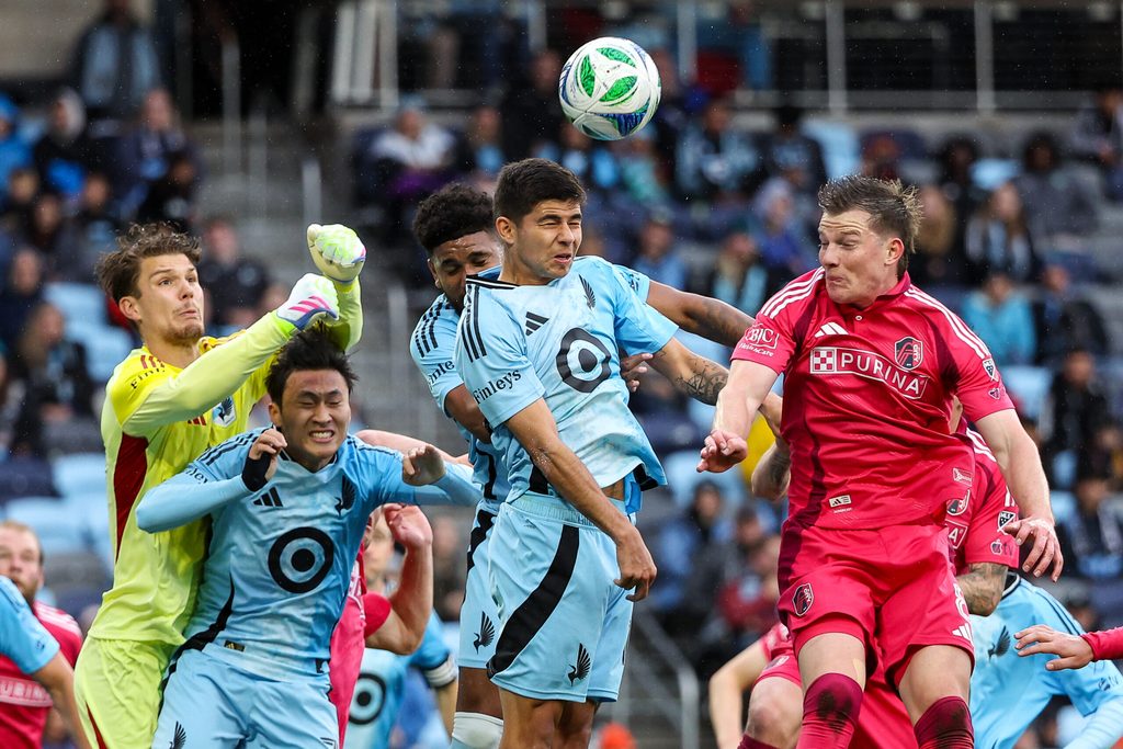 May 21, 2025; St. Paul, Minnesota, USA; Minnesota United and St. Louis City players jump for a corner kick during the first half of the US Open Cup-Round of 16 match at Allianz Field. Mandatory Credit: Matt Krohn-Imagn Images
