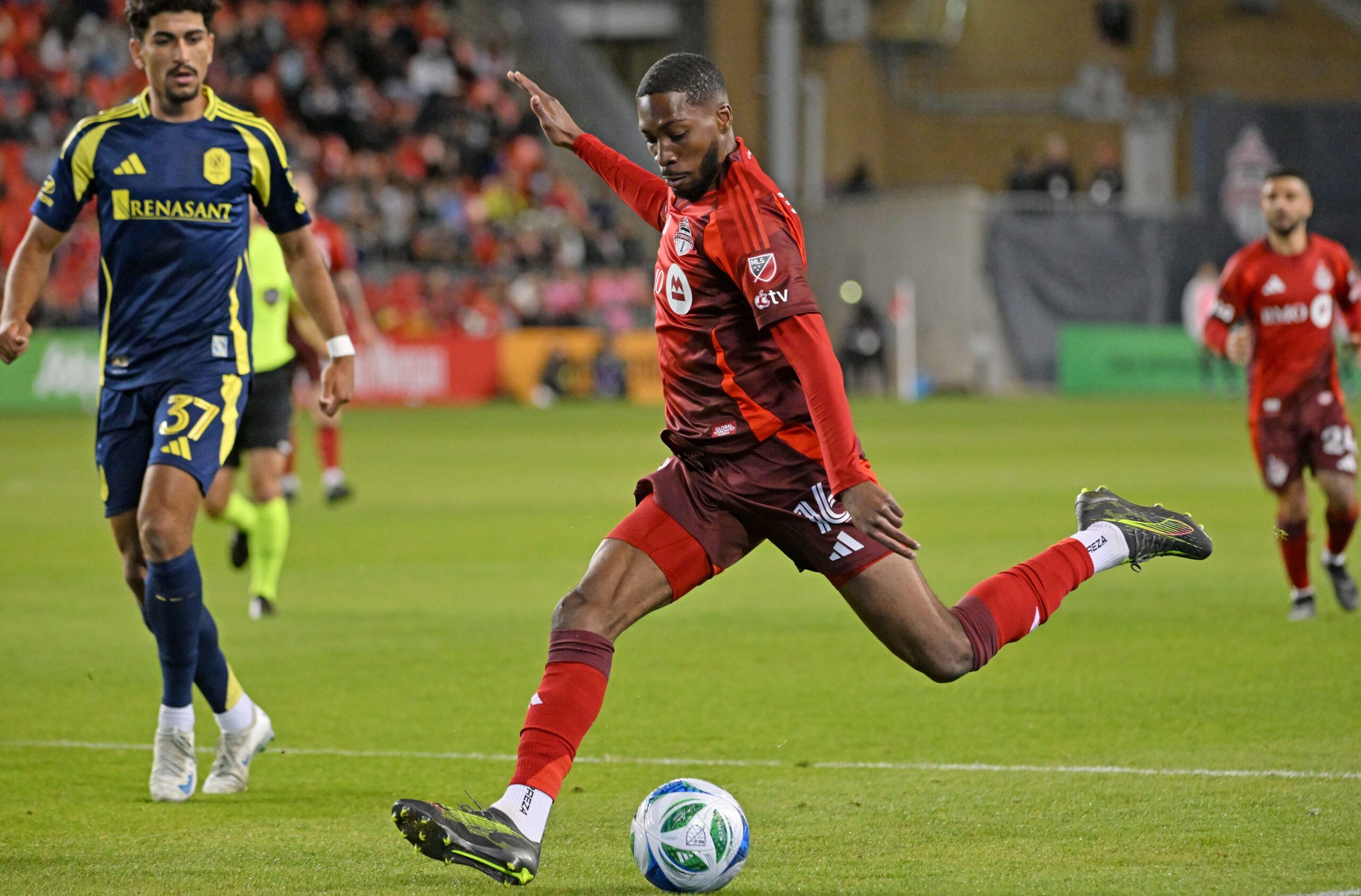 May 24, 2025; Toronto, Ontario, CAN; Toronto FC forward Tyrese Spicer (16) shoots the ball against Nashville SC in the second half at BMO Field. Mandatory Credit: Dan Hamilton-Imagn Images