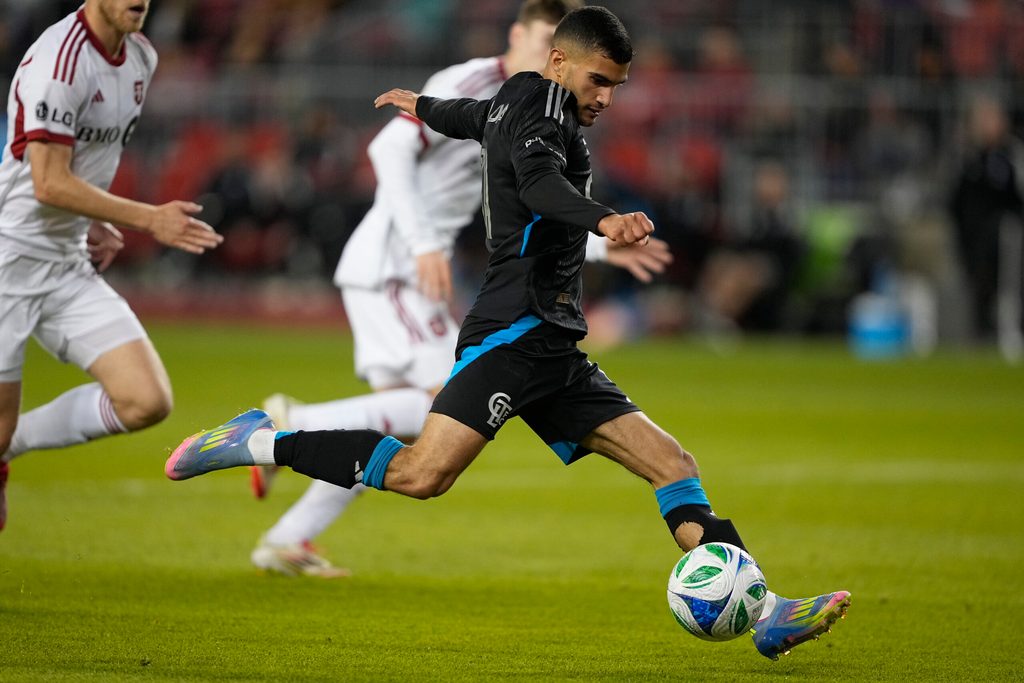 May 31, 2025; Toronto, Ontario, CAN; Charlotte FC forward Liel Abada (11) goes to kick the ball against Toronto FC during the second half at BMO Field. Mandatory Credit: John E. Sokolowski-Imagn Images