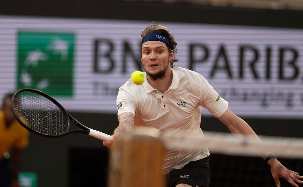 Jun 4, 2025; Paris, FR; Alexander Bublik of Kazakhstan returns a shot during his match against Jannik Sinner of Italy on day 11 at Roland Garros Stadium. Mandatory Credit: Susan Mullane-Imagn Images