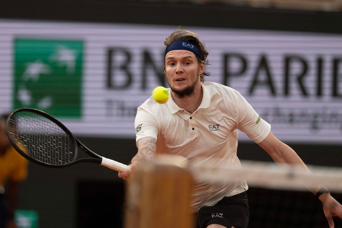 Jun 4, 2025; Paris, FR; Alexander Bublik of Kazakhstan returns a shot during his match against Jannik Sinner of Italy on day 11 at Roland Garros Stadium. Mandatory Credit: Susan Mullane-Imagn Images