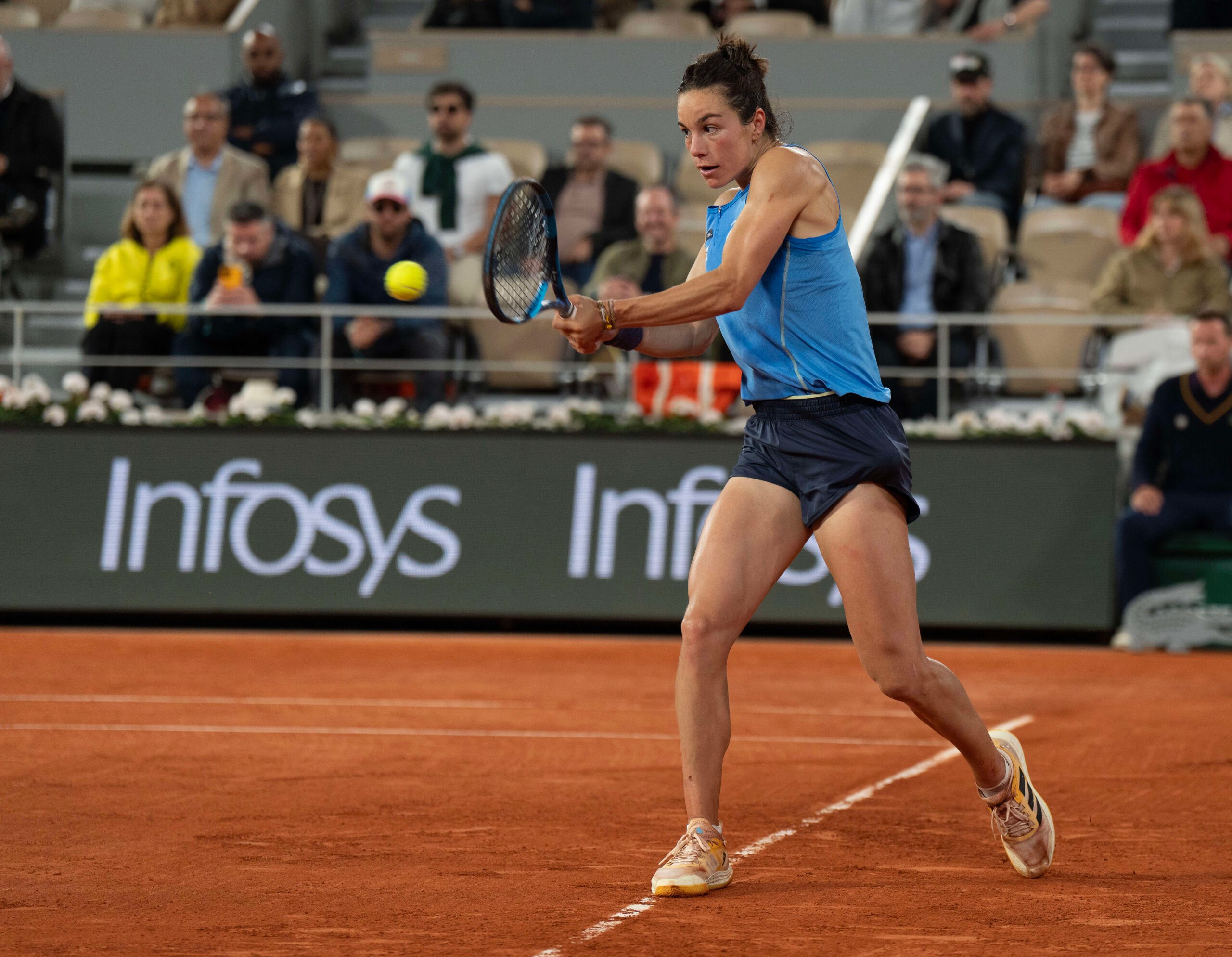 Jun 5, 2025; Paris, FR;  Lois Boisson of France returns a shot during her match against Coco Gauff of the United States on day 12 at Roland Garros Stadium. Mandatory Credit: Susan Mullane-Imagn Images