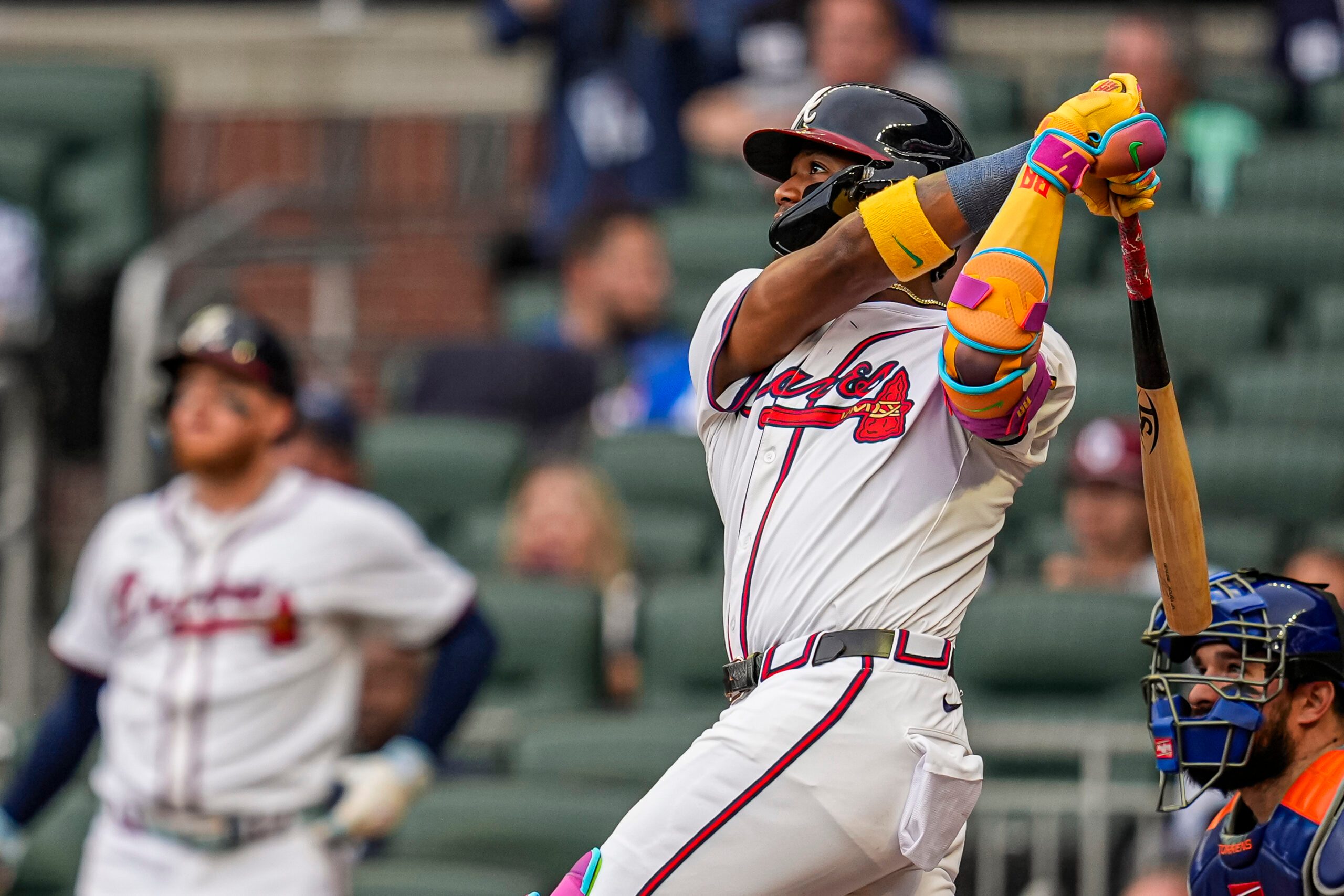 Jun 18, 2025; Cumberland, Georgia, USA; Atlanta Braves right fielder Ronald Acuna Jr (13) hits a lead off home run against the New York Mets during the first inning at Truist Park. Mandatory Credit: Dale Zanine-Imagn Images