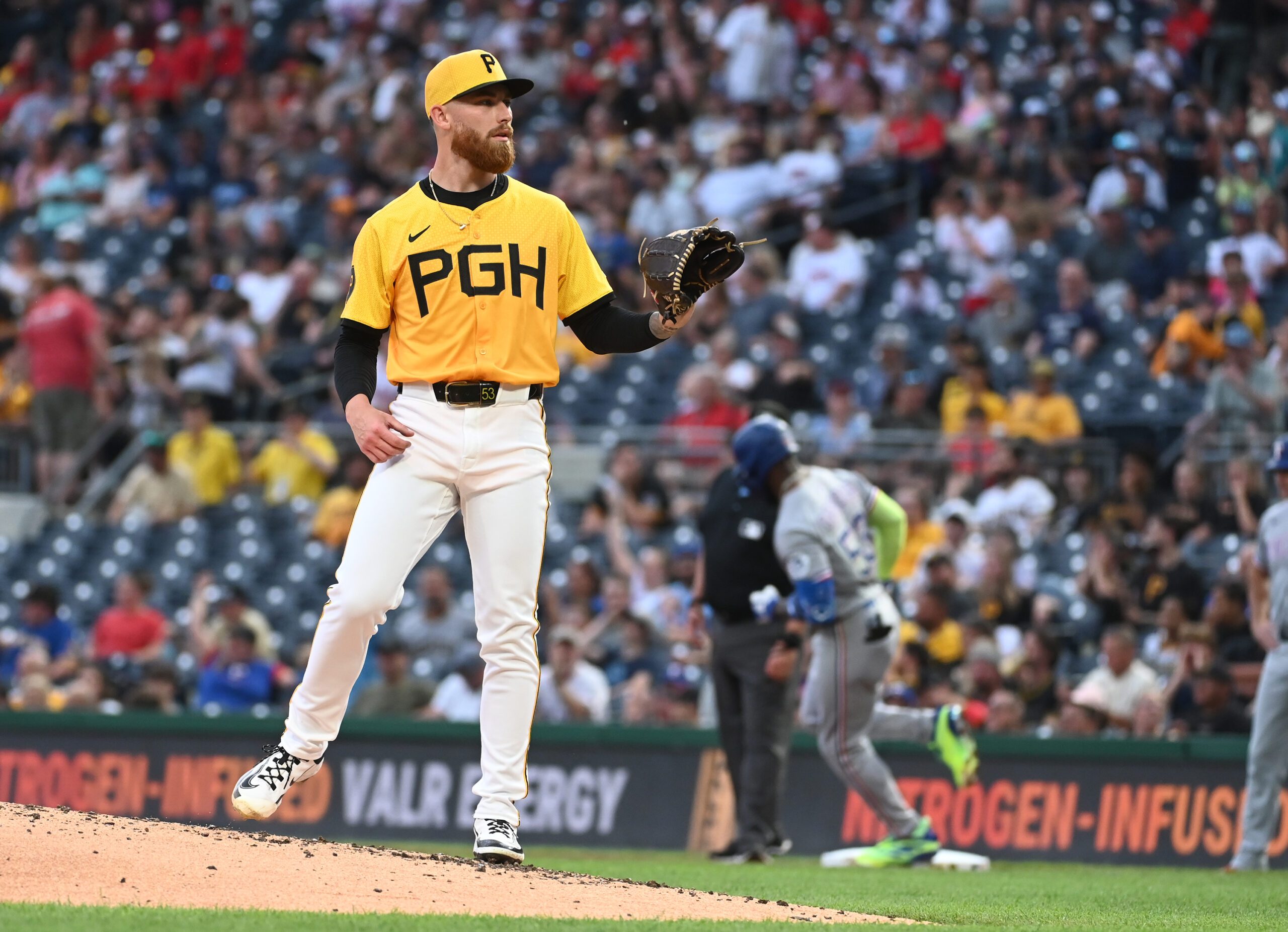 Jun 11, 2025; Pittsburgh, Pennsylvania, USA; Pittsburgh Pirates sarting pitcher Mike Burrows gets a new baseball after Texas Rangers Adolis Garcia hit a home run during the fourth inning at PNC Park. Mandatory Credit: Philip G. Pavely-Imagn Images
