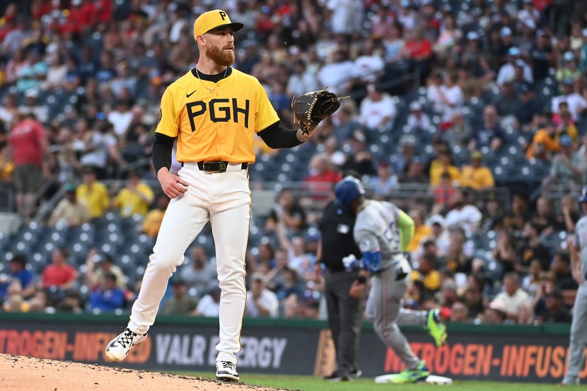 Jun 11, 2025; Pittsburgh, Pennsylvania, USA; Pittsburgh Pirates sarting pitcher Mike Burrows gets a new baseball after Texas Rangers Adolis Garcia hit a home run during the fourth inning at PNC Park. Mandatory Credit: Philip G. Pavely-Imagn Images