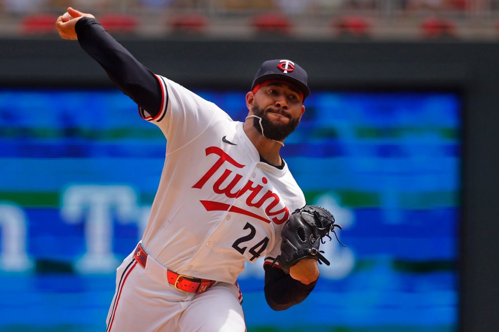 Jun 21, 2025; Minneapolis, Minnesota, USA; Minnesota Twins starting pitcher Simeon Woods Richardson (24) throws to the Milwaukee Brewers in the first inning at Target Field. Mandatory Credit: Bruce Kluckhohn-Imagn Images