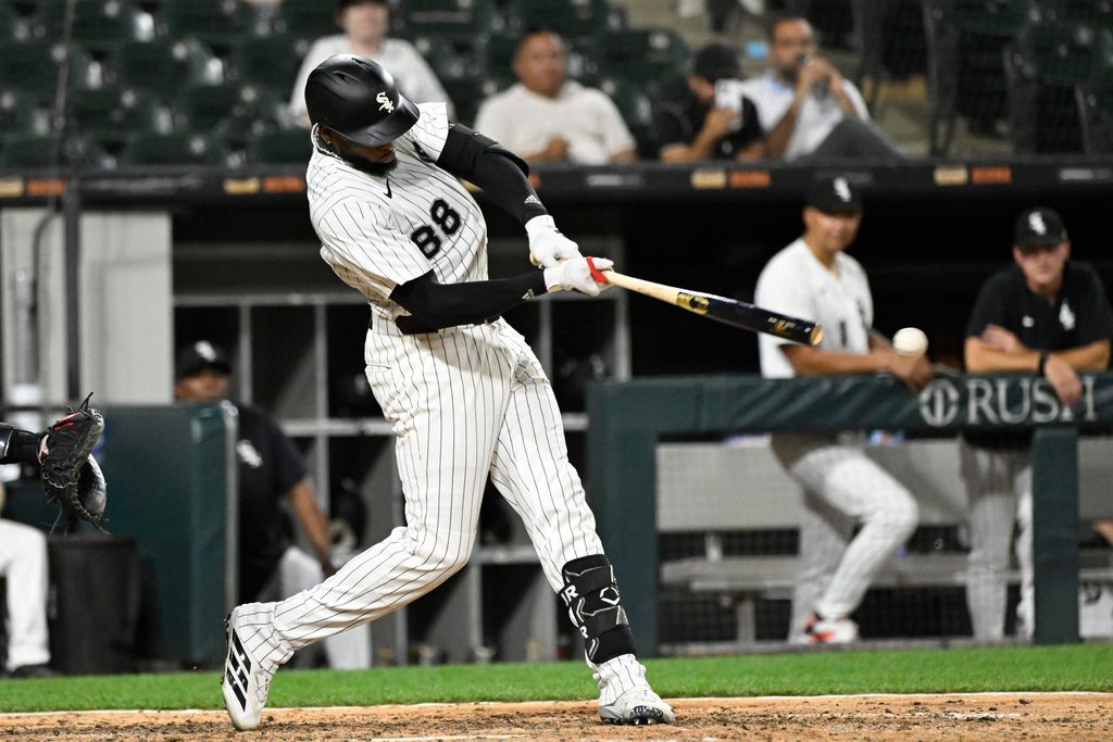 Jun 23, 2025; Chicago, Illinois, USA; Chicago White Sox outfielder Luis Robert Jr. (88) hits a single during the ninth inning against the Arizona Diamondbacks at Rate Field. Mandatory Credit: Matt Marton-Imagn Images