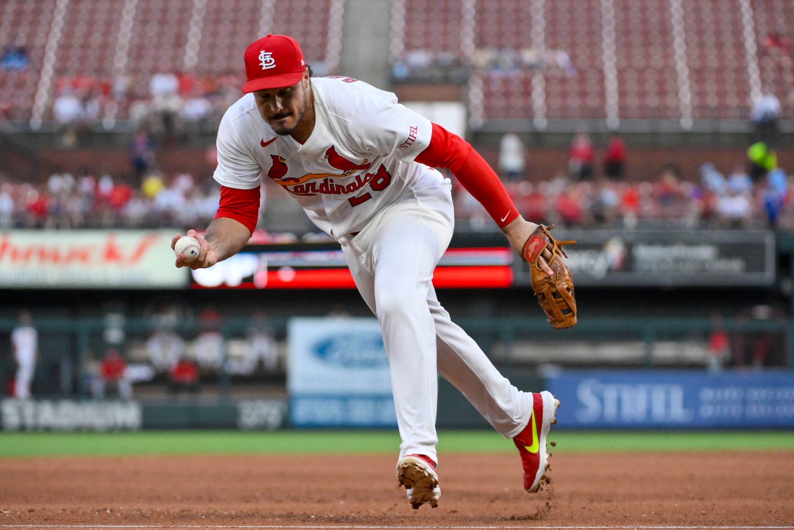 Jun 24, 2025; St. Louis, Missouri, USA; St. Louis Cardinals third baseman Nolan Arenado (28) fields a ground ball against the Chicago Cubs during the fifth inning at Busch Stadium. Mandatory Credit: Jeff Curry-Imagn Images