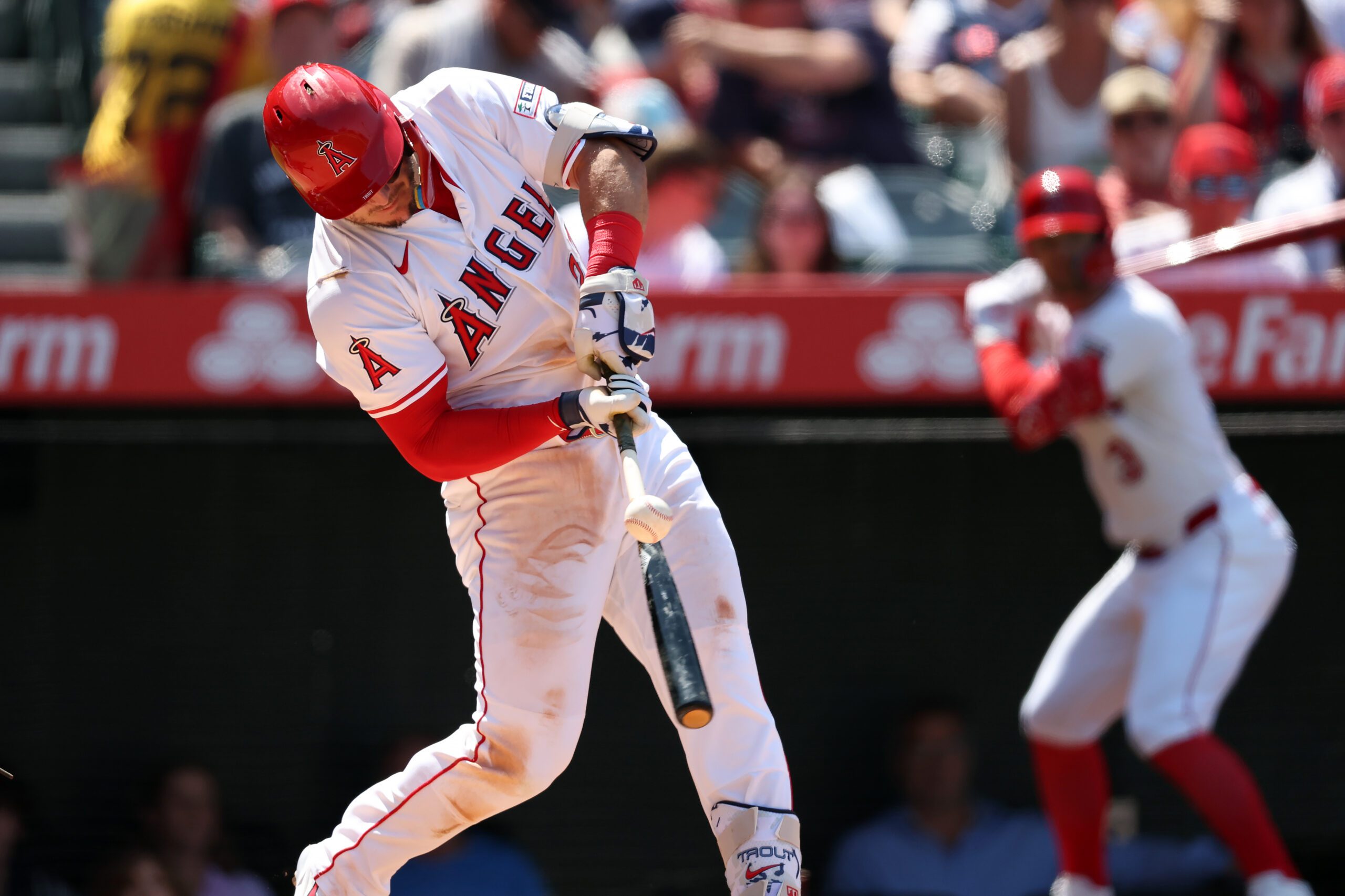 Jun 25, 2025; Anaheim, California, USA;  Los Angeles Angels designated hitter Mike Trout (27) hits an RBI single during the sixth inning against the Boston Red Sox at Angel Stadium. Mandatory Credit: Kiyoshi Mio-Imagn Images