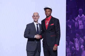 Jun 25, 2025; Brooklyn, NY, USA;  Ace Bailey stands with NBA commissioner Adam Silver after being selected as the fifth pick by the Utah Jazz in the first round of the 2025 NBA Draft at Barclays Center. Mandatory Credit: Brad Penner-Imagn Images