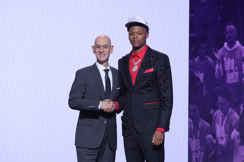 Jun 25, 2025; Brooklyn, NY, USA; Ace Bailey stands with NBA commissioner Adam Silver after being selected as the fifth pick by the Utah Jazz in the first round of the 2025 NBA Draft at Barclays Center. Mandatory Credit: Brad Penner-Imagn Images