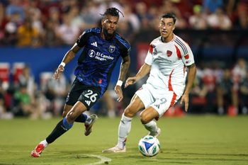 Jun 25, 2025; Frisco, Texas, USA; San Jose Earthquakes defender Rodrigues (26) controls the ball against FC Dallas forward Petar Musa (9) during the first half at Toyota Stadium. Mandatory Credit: Tim Heitman-Imagn Images