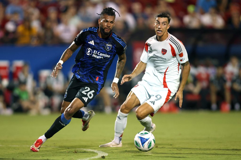 Jun 25, 2025; Frisco, Texas, USA; San Jose Earthquakes defender Rodrigues (26) controls the ball against FC Dallas forward Petar Musa (9) during the first half at Toyota Stadium. Mandatory Credit: Tim Heitman-Imagn Images