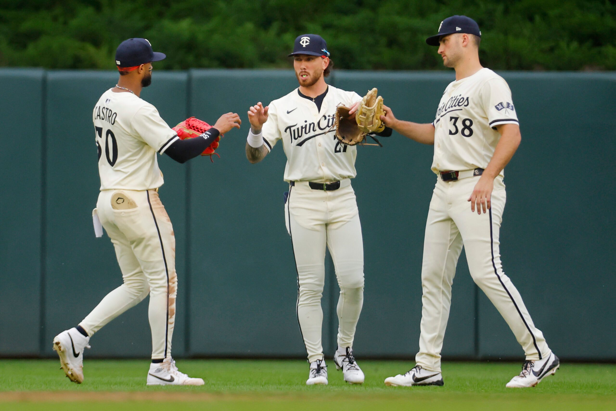 Jun 26, 2025; Minneapolis, Minnesota, USA; Minnesota Twins left fielder Willi Castro (50) center fielder DaShawn Keirsey (21) and right fielder Matt Wallner (38) celebrate the win over the Seattle Mariners at Target Field. Mandatory Credit: Bruce Kluckhohn-Imagn Images