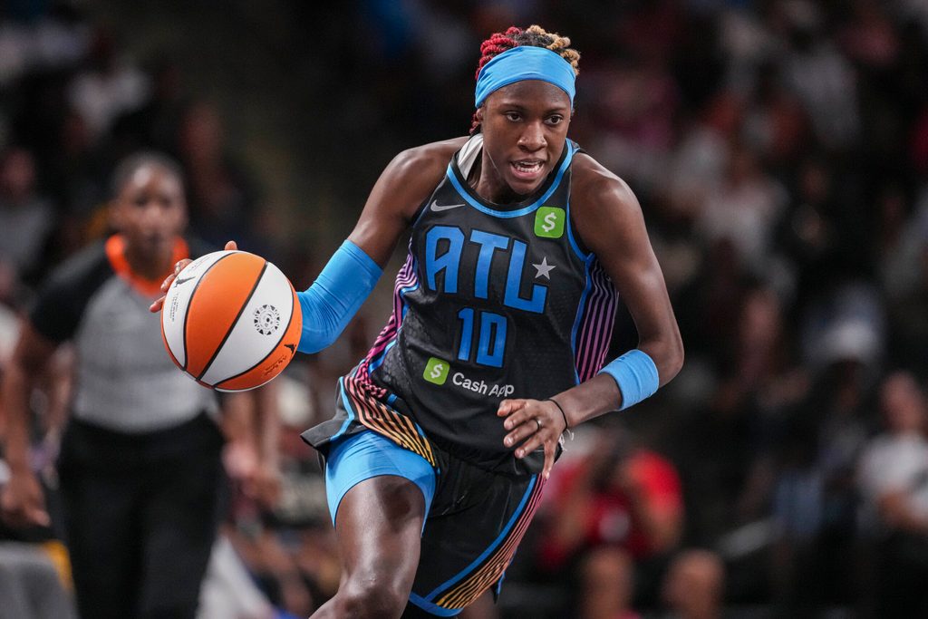 Jun 27, 2025; College Park, Georgia, USA; Atlanta Dream guard Rhyne Howard (10) brings the ball up the court against the Minnesota Lynx during the first half at Gateway Center Arena at College Park. Mandatory Credit: Dale Zanine-Imagn Images