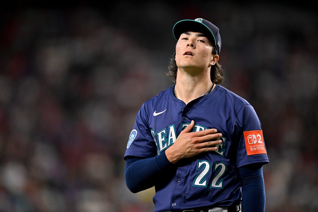 Jun 28, 2025; Arlington, Texas, USA; Seattle Mariners starting pitcher Bryan Woo (22) comes off the field after he pitches against the Texas Rangers during the first inning at Globe Life Field. Mandatory Credit: Jerome Miron-Imagn Images