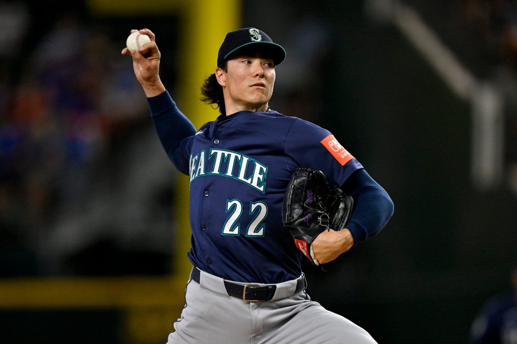 Jun 28, 2025; Arlington, Texas, USA; Seattle Mariners starting pitcher Bryan Woo (22) pitches against the Texas Rangers during the first inning at Globe Life Field. Mandatory Credit: Jerome Miron-Imagn Images