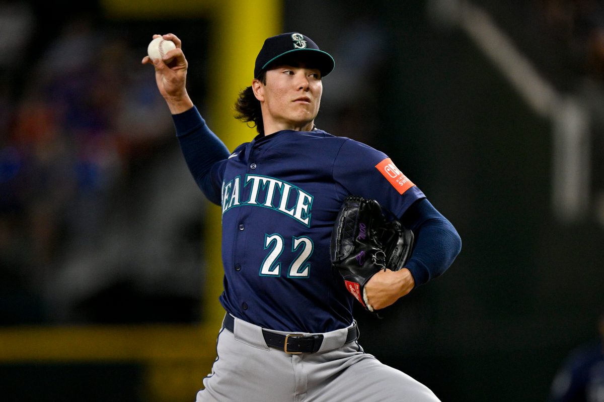 Jun 28, 2025; Arlington, Texas, USA; Seattle Mariners starting pitcher Bryan Woo (22) pitches against the Texas Rangers during the first inning at Globe Life Field. Mandatory Credit: Jerome Miron-Imagn Images