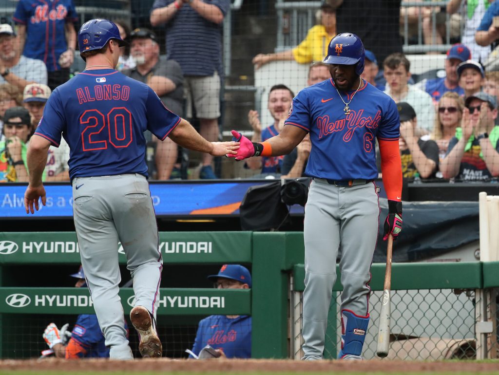Jun 28, 2025; Pittsburgh, Pennsylvania, USA; New York Mets first baseman Pete Alonso (20) celebrates scoring a run with designated hitter Starling Marte (6) against the Pittsburgh Pirates during the fifth inning at PNC Park. Mandatory Credit: Charles LeClaire-Imagn Images