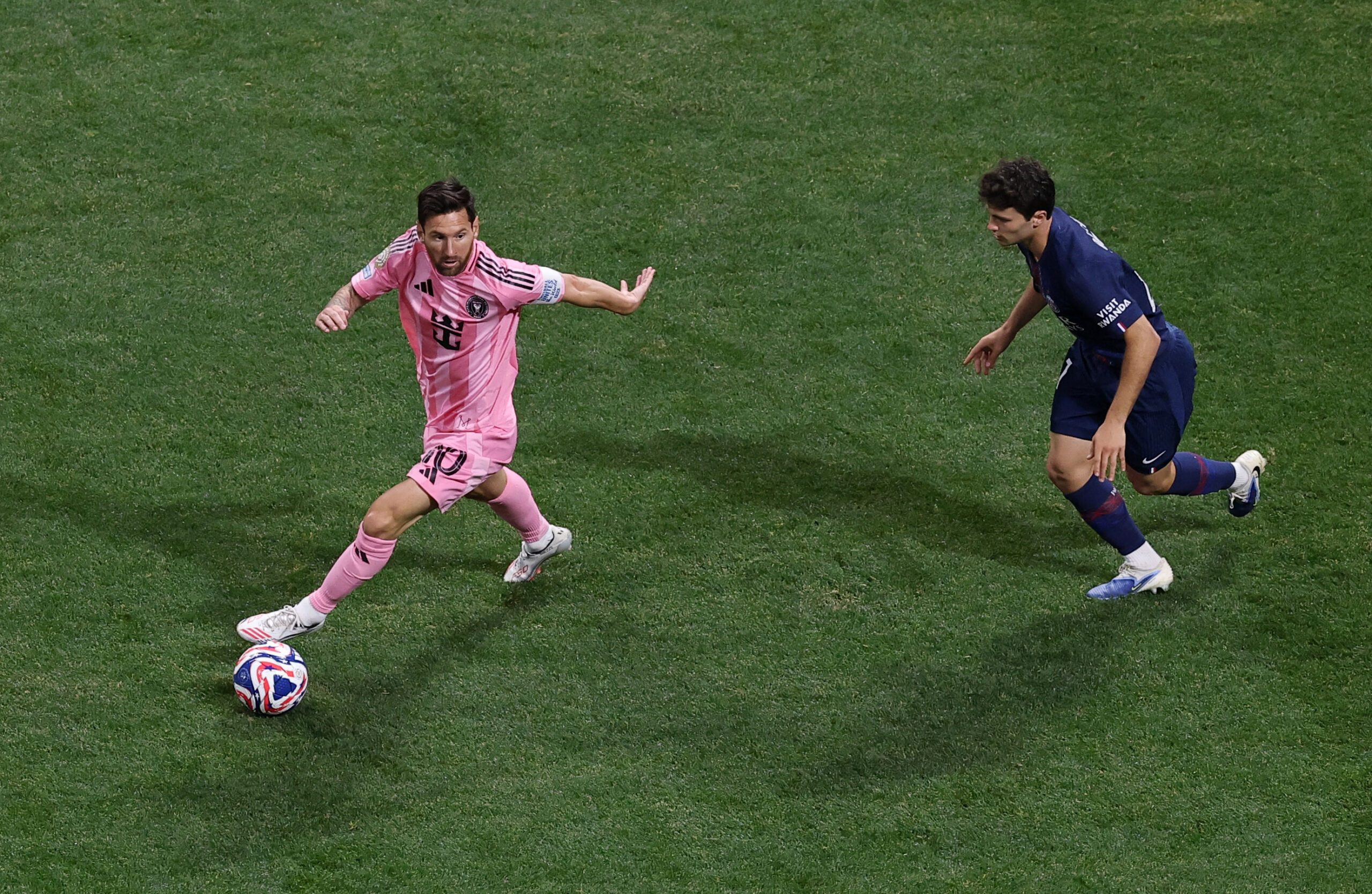 [Subscription Customers Only] Jun 29, 2025; Atlanta, Georgia, USA; Inter Miami FC forward Lionel Messi (10) kicks the ball past Paris Saint-Germain midfielder Fabian Ruiz (8) during a round of 16 match of the 2025 FIFA Club World Cup at Mercedes-Benz Stadium. Mandatory Credit: Amanda Perobelli-Reuters via Imagn Images