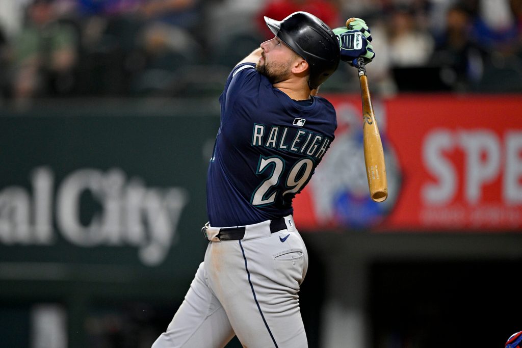 Jun 28, 2025; Arlington, Texas, USA; Seattle Mariners catcher Cal Raleigh (29) bats during the game between the Texas Rangers and the Seattle Mariners at Globe Life Field. Mandatory Credit: Jerome Miron-Imagn Images