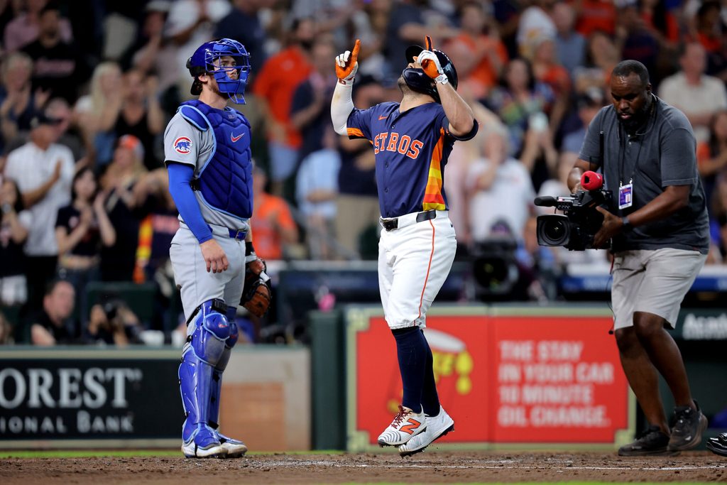Jun 29, 2025; Houston, Texas, USA; Houston Astros second baseman Jose Altuve (27) crosses home plate after hitting a two-run home run to left field against the Chicago Cubs during the fifth inning at Daikin Park. Mandatory Credit: Erik Williams-Imagn Images