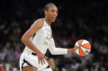 Jun 29, 2025; Phoenix, Arizona, USA; Las Vegas Aces center A'ja Wilson (22) drives against the Phoenix Mercury in the first half at Footprint Center. Mandatory Credit: Rick Scuteri-Imagn Images