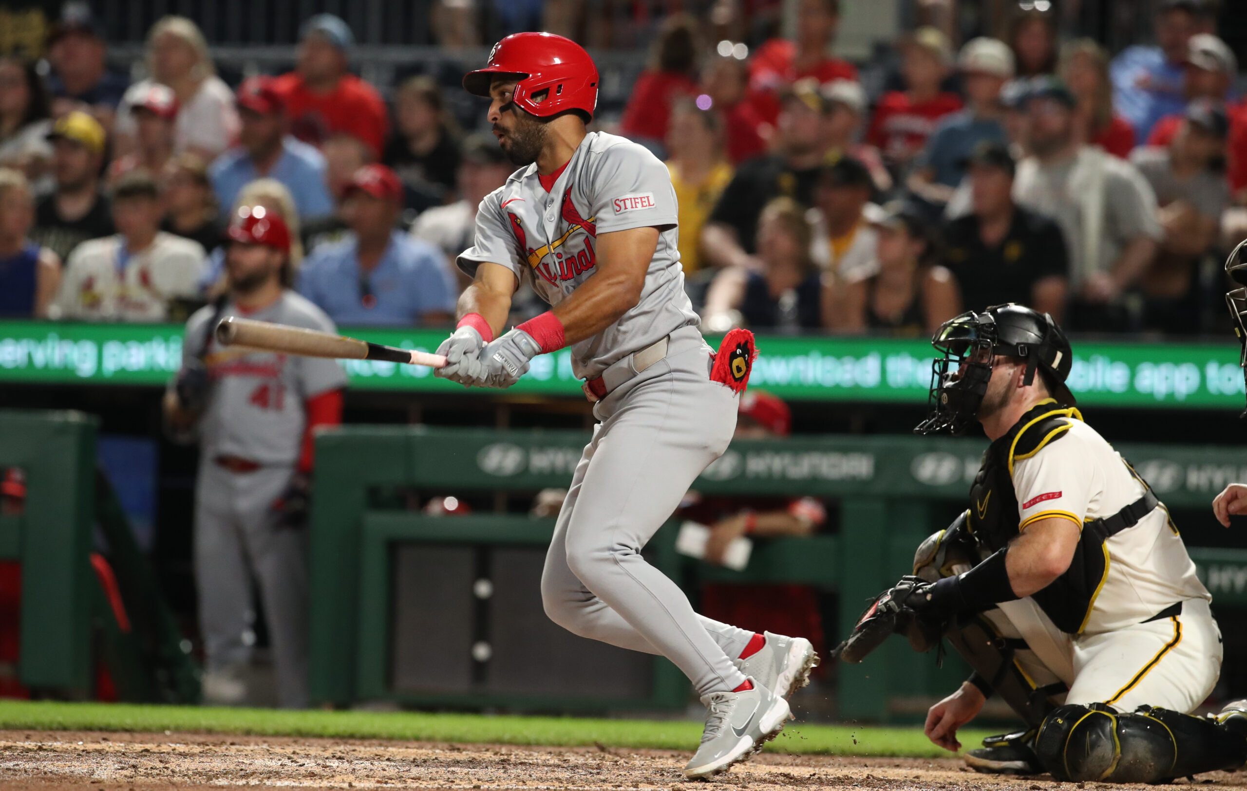 Jun 30, 2025; Pittsburgh, Pennsylvania, USA;  St. Louis Cardinals left fielder Jose Fermin (15) hits a single against the Pittsburgh Pirates during the ninth inning at PNC Park. Mandatory Credit: Charles LeClaire-Imagn Images