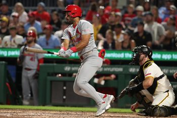 Jun 30, 2025; Pittsburgh, Pennsylvania, USA;  St. Louis Cardinals left fielder Jose Fermin (15) hits a single against the Pittsburgh Pirates during the ninth inning at PNC Park. Mandatory Credit: Charles LeClaire-Imagn Images