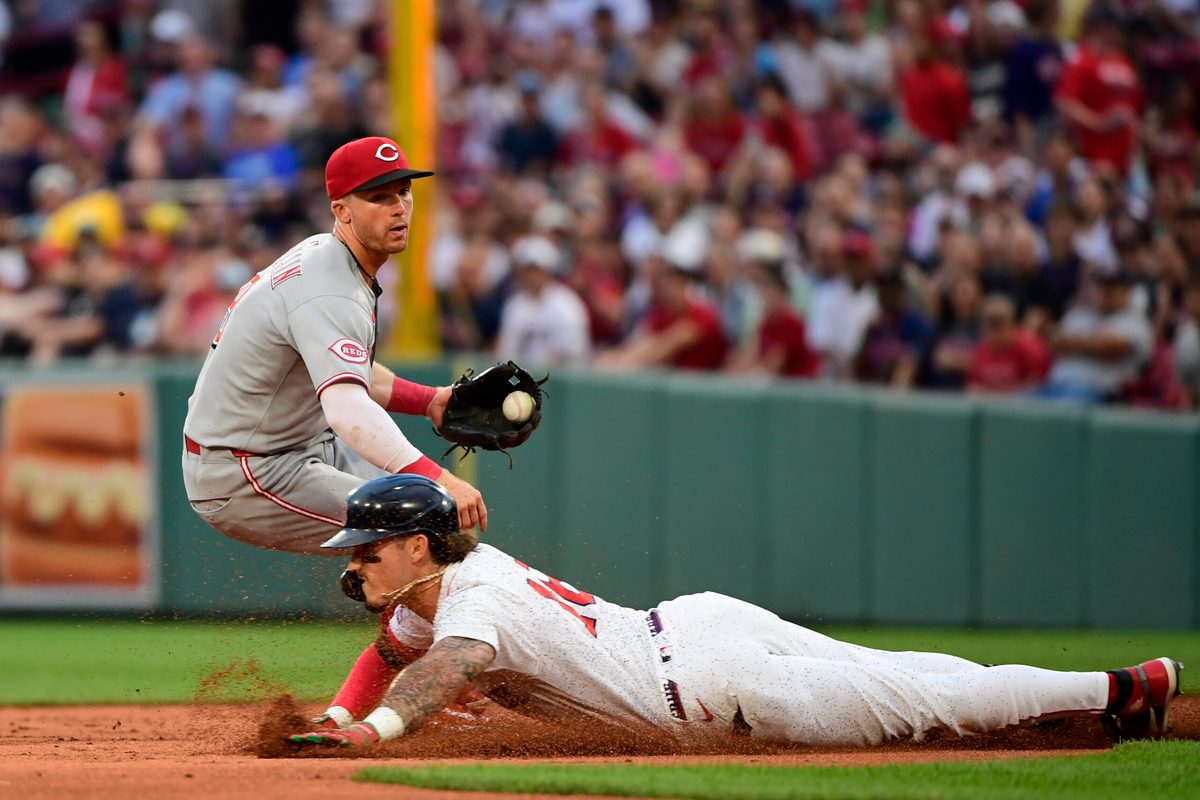 Jul 1, 2025; Boston, Massachusetts, USA; Boston Red Sox left fielder Jarren Duran (16) slides past Cincinnati Reds second baseman Matt McLain (9) for a double during the first inning at Fenway Park. Mandatory Credit: Bob DeChiara-Imagn Images