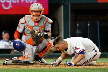 Jul 1, 2025; Arlington, Texas, USA; Texas Rangers shortstop Corey Seager (5) gets hit by a pitch during the eighth inning against the Baltimore Orioles at Globe Life Field. Mandatory Credit: Kevin Jairaj-Imagn Images