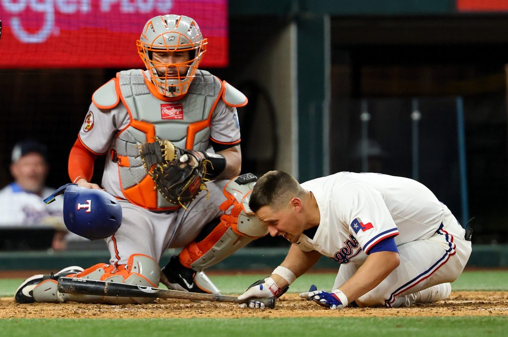 Jul 1, 2025; Arlington, Texas, USA; Texas Rangers shortstop Corey Seager (5) gets hit by a pitch during the eighth inning against the Baltimore Orioles at Globe Life Field. Mandatory Credit: Kevin Jairaj-Imagn Images