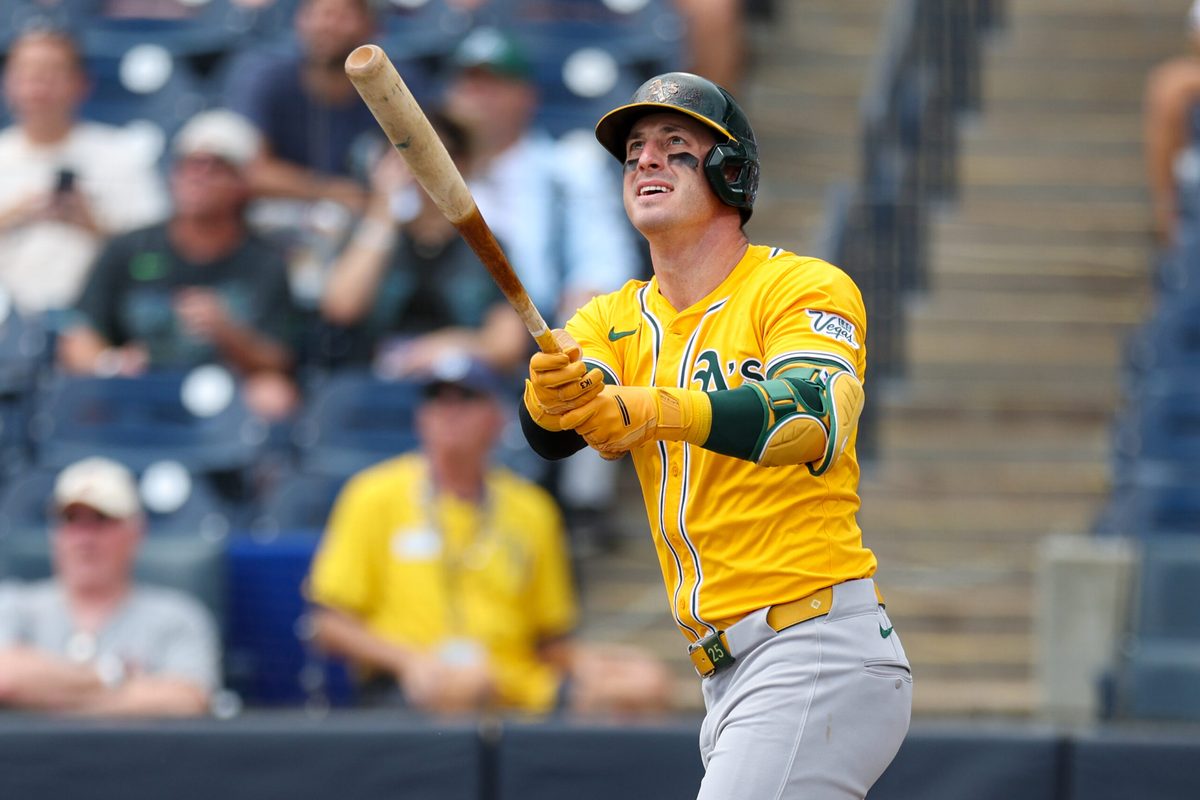 Jul 2, 2025; Tampa, Florida, USA; Athletics right fielder Brent Rooker (25) hits a home run against the Tampa Bay Rays in the first inning at George M. Steinbrenner Field. Mandatory Credit: Nathan Ray Seebeck-Imagn Images