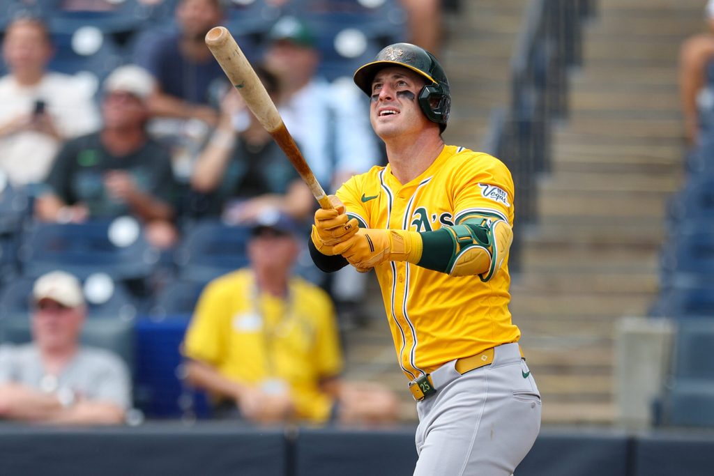 Jul 2, 2025; Tampa, Florida, USA; Athletics right fielder Brent Rooker (25) hits a home run against the Tampa Bay Rays in the first inning at George M. Steinbrenner Field. Mandatory Credit: Nathan Ray Seebeck-Imagn Images