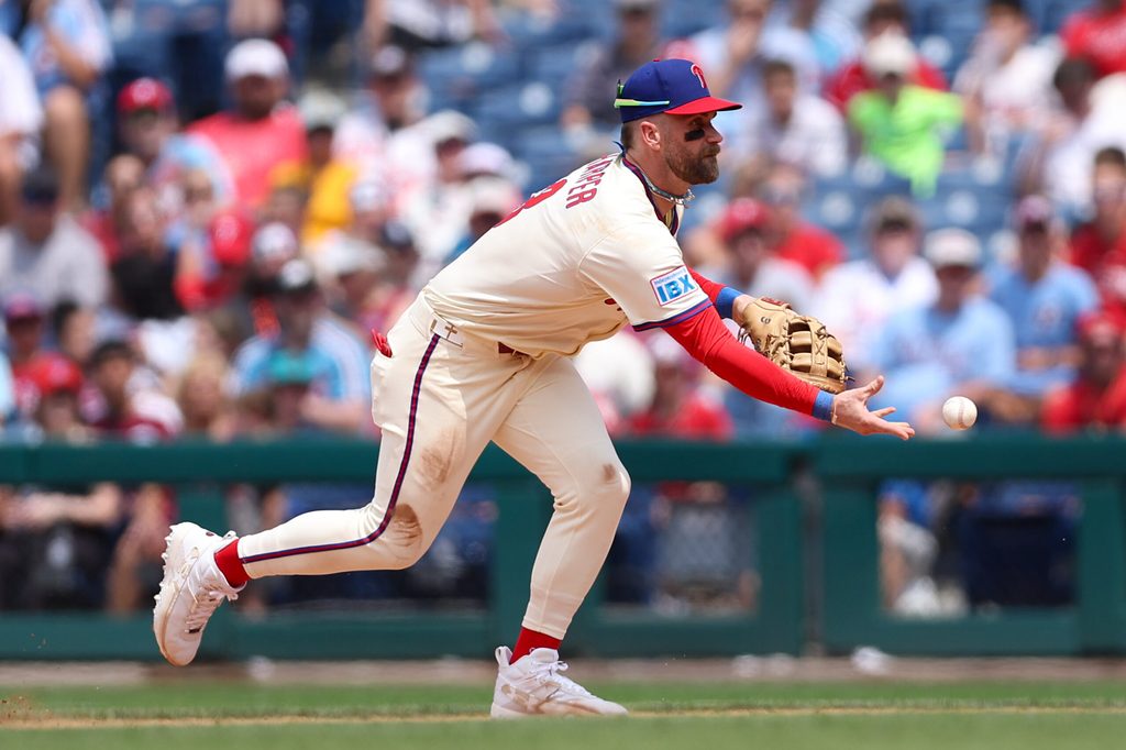 Jul 2, 2025; Philadelphia, Pennsylvania, USA; Philadelphia Phillies first base Bryce Harper (3) fields a ball for an out against the San Diego Padres during the fifth inning at Citizens Bank Park. Mandatory Credit: Bill Streicher-Imagn Images