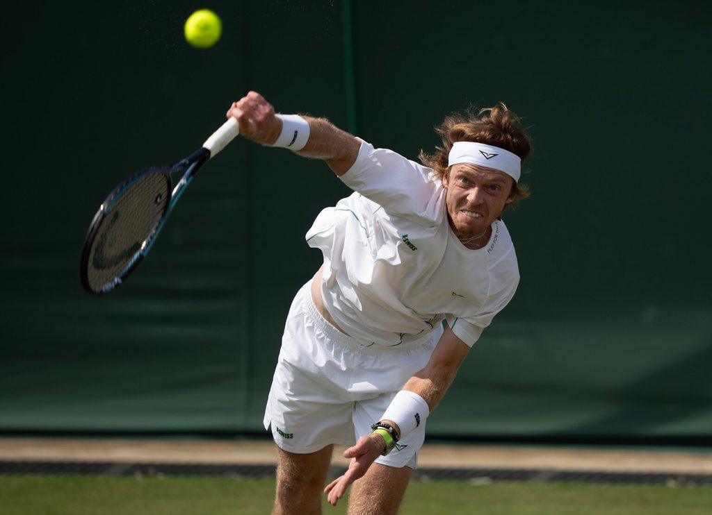 Jul 2, 2025; Wimbledon, United Kingdom; Andrey Rublev serves the ball during his match against Lloyd Harris of South Africa on day three at the All England Lawn Tennis and Croquet Club. Mandatory Credit: Susan Mullane-Imagn Images