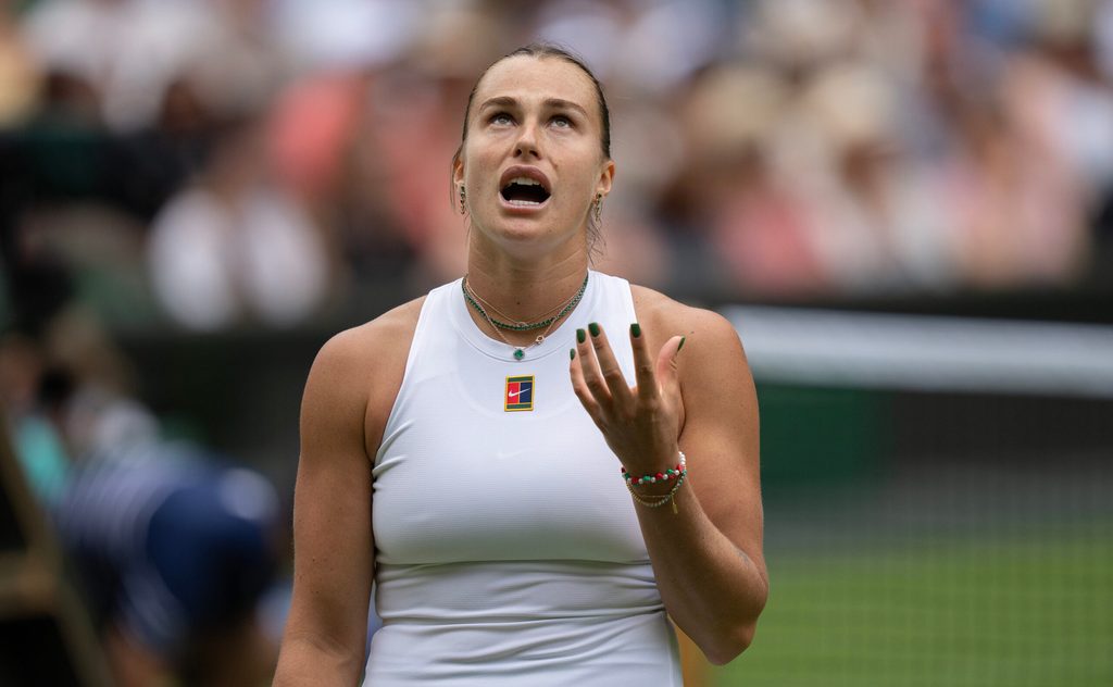 Jul 2, 2025; Wimbledon, United Kingdom; Aryna Sabalenka reacts to a point during her match against Marie Bouzkova of the Czech Republic on day three at the All England Lawn Tennis and Croquet Club. Mandatory Credit: Susan Mullane-Imagn Images