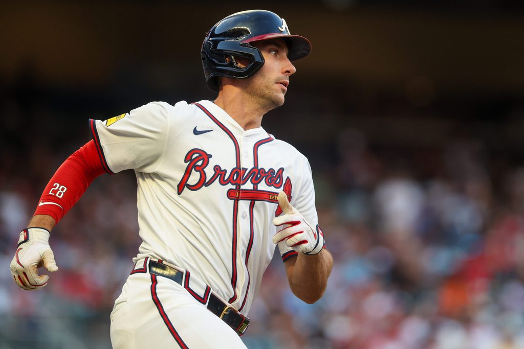 Jul 2, 2025; Atlanta, Georgia, USA; Atlanta Braves first baseman Matt Olson (28) hits a double against the Los Angeles Angels in the third inning at Truist Park. Mandatory Credit: Brett Davis-Imagn Images