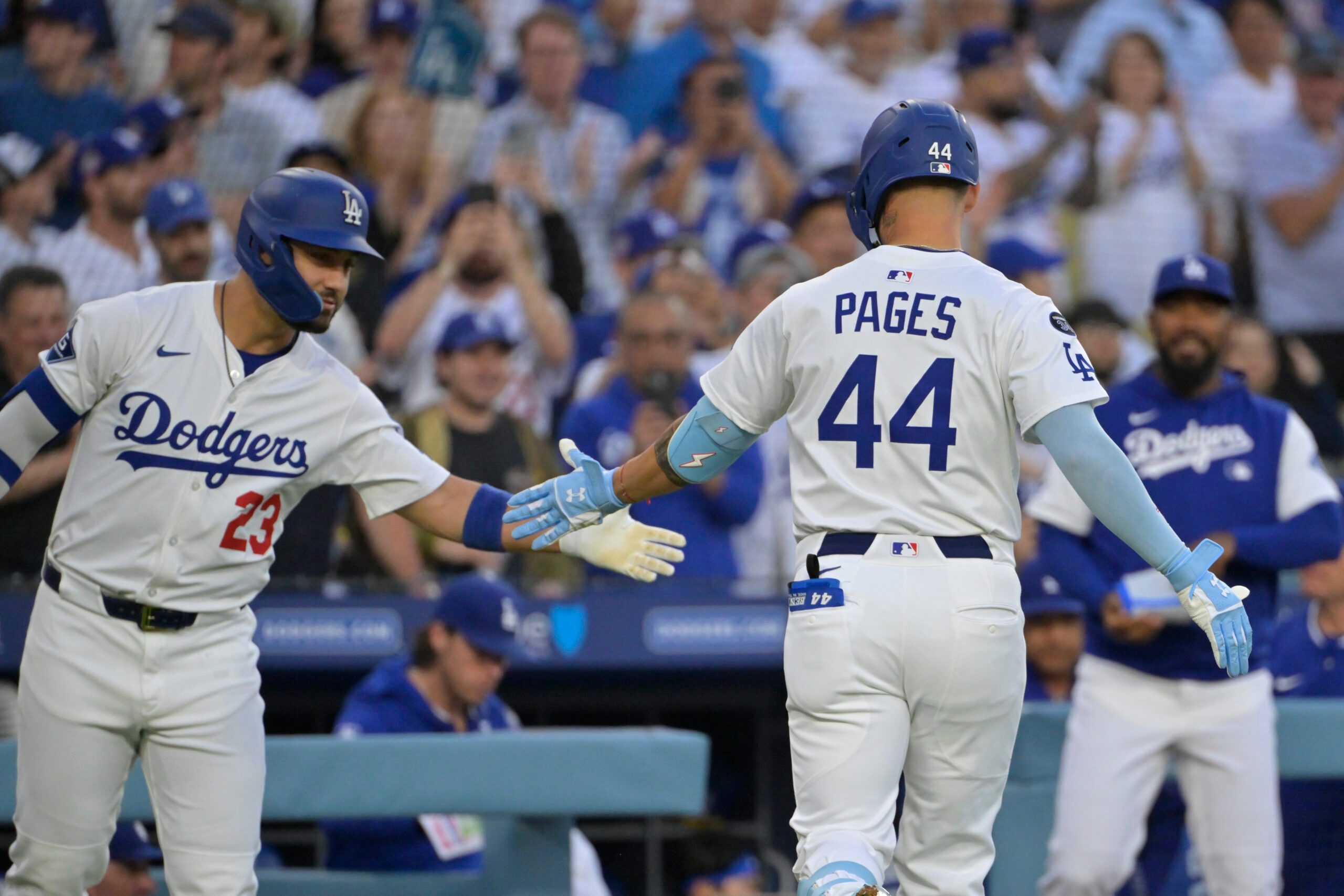 Jul 2, 2025; Los Angeles, California, USA; Los Angeles Dodgers outfielder Michael Conforto (23) greets outfielder Andy Pages (44) after hitting solo home run during the second inning against the Chicago White Sox at Dodger Stadium. Mandatory Credit: Jayne Kamin-Oncea-Imagn Images