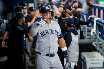 Jul 2, 2025; Toronto, Ontario, CAN; New York Yankees outfielder Aaron Judge (99) celebrates after hitting a home run during the eighth inning in their MLB game against the Toronto Blue Jays at Rogers Centre. Mandatory Credit: Kevin Sousa-Imagn Images