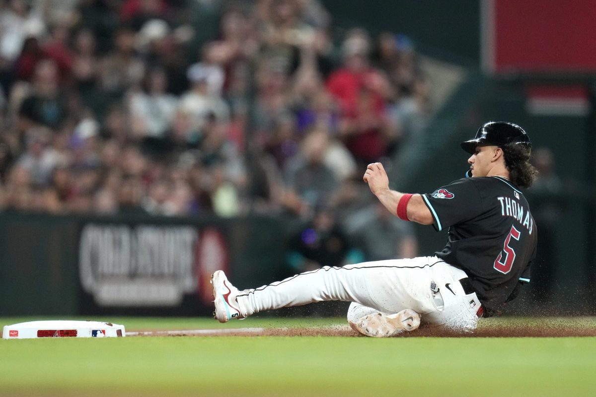 Arizona Diamondbacks base runner Alek Thomas (5) slides safely into third base against the San Francisco Giants at Chase Field on June 30, 2025.