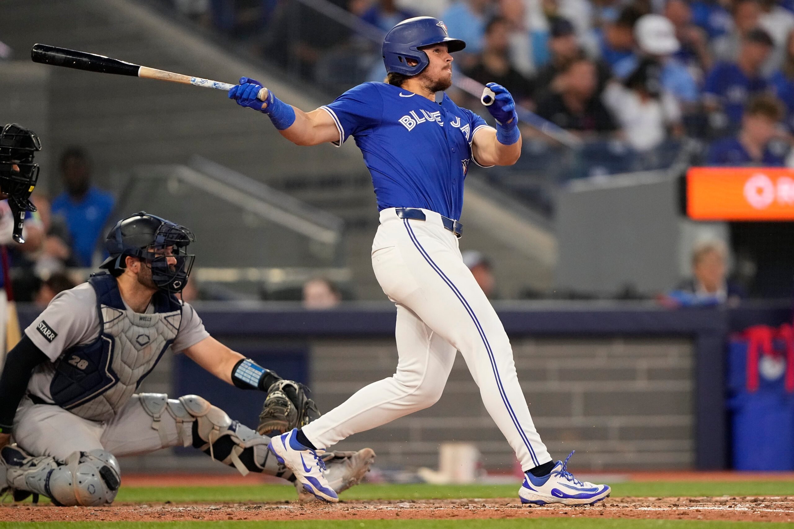 Jul 3, 2025; Toronto, Ontario, CAN; Toronto Blue Jays right fielder Addison Barger (47) hits a solo home run against the New York Yankees during the fifth inning at Rogers Centre. Mandatory Credit: John E. Sokolowski-Imagn Images